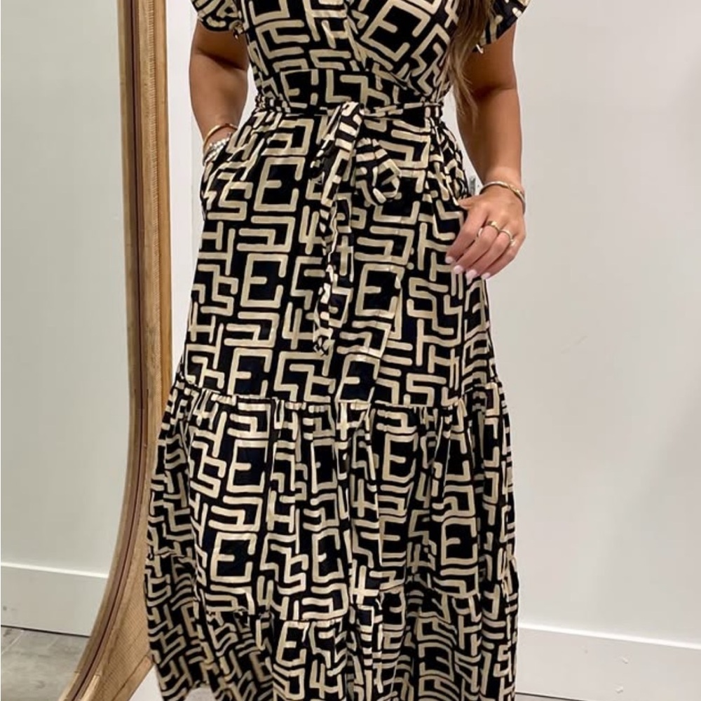 Elegant Black and Cream Patterned Dress